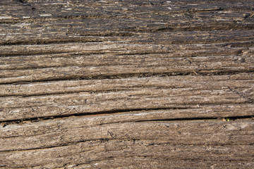 Texture of old wood with diagonal cracks