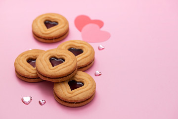 cookies with hearts on pink background