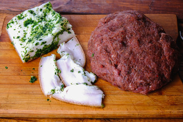 cooking pork sausages composition on a wooden background