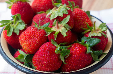 ripe red strawberry in a bowl