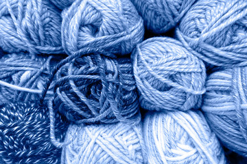 Yarn skeins as background in the colour of the year 2020 (Classic blue)