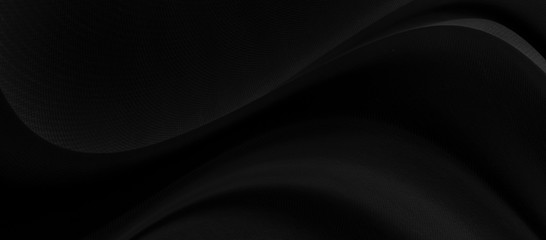 Black gray satin dark fabric texture luxurious shiny that is abstract silk cloth background with patterns soft waves blur beautiful.