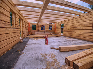 Building family house from spruce logs.  Semi finished building