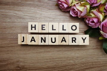 Hello January alphabet letters on wooden background