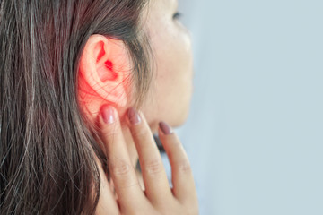 woman suffering from ear pain , Tinnitus concept - obrazy, fototapety, plakaty