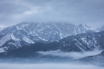 Fototapeta na wymiar Winter in Tatra Moutains in Poland. High Tatras landscape photos.