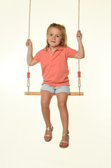 young girl on a swing