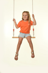 young girl on a swing