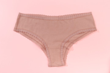Female panties over pink  background - Image