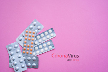 Concept novel coronavirus 2019-nCoV. Chinese coronavirus outbreak. MERS-Cov middle East respiratory syndrome coronavirus.Pills and thermometer with CORONAVIRUS text. Virus Pandemic Protection Concept