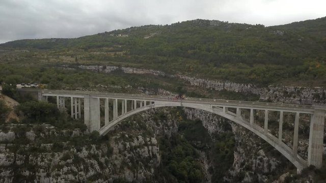 Massive bridge over a gorgeous canyon in Turkey, mountain on the background, 4k