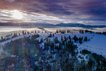 Obraz premium Pasul Tihuta, Romania seen from a drone early in a winter morning. 