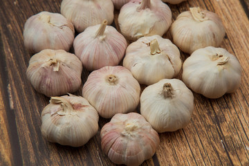 Garlic.Garlic on a wooden background. Vegetarianism.Spices.