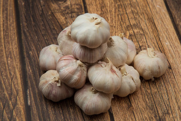 Garlic.Garlic on a wooden background. Vegetarianism.Spices.