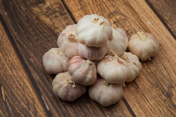 Garlic.Garlic on a wooden background. Vegetarianism.Spices.