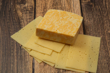 Cheese.Cheese on a wooden background. Dairy product.Breakfast.