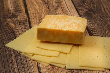 Cheese.Cheese on a wooden background. Dairy product.Breakfast.