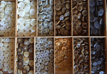 drawer with many different buttons, crafts hobbies sewing handmade