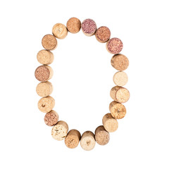 The number 0 is made from wine corks, close-up. Isolated on white background