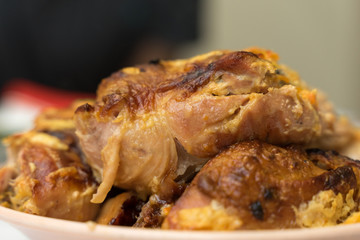 pieces of appetizing fried chicken close-up with a crispy crust lie on a plate