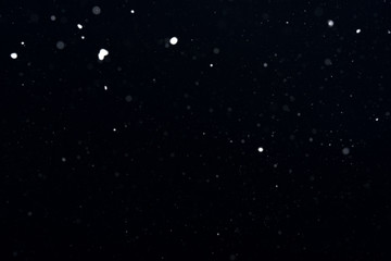 Obraz premium snow on a black background. snow texture