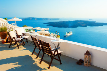 Santorini island, Greece. Beautiful terrace with sea view. Travel destinations concept