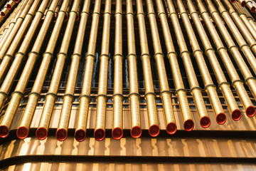 A close-up of the golden tubular structure