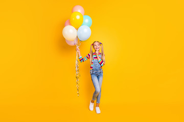 Full length photo positive inspired kid hold helium air baloons look copyspace think thoughts...