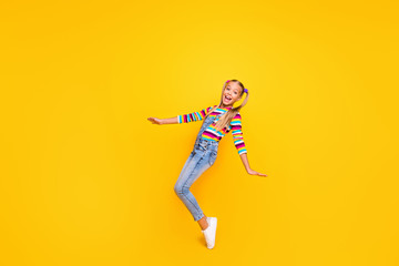 Fototapeta na wymiar Full size photo of positive cheerful kid enjoy her spring winter weekend holidays feel rejoice wear jumper white shoes isolated over bright color background