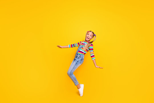Full size photo of positive cheerful kid enjoy her spring winter weekend holidays feel rejoice wear jumper white shoes isolated over bright color background