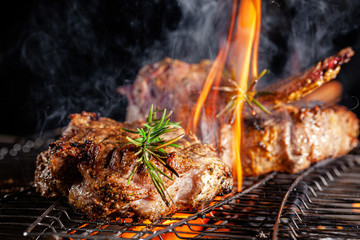 Chef cook fries meat, beef steak on an open fire in a restaurant. background image, copy space text - obrazy, fototapety, plakaty