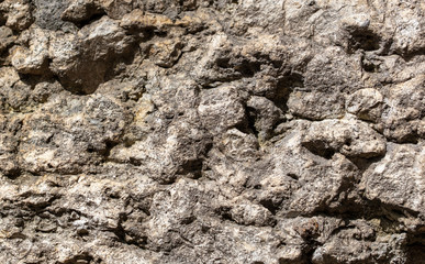 Naklejka premium Stones on the rock as an abstract background