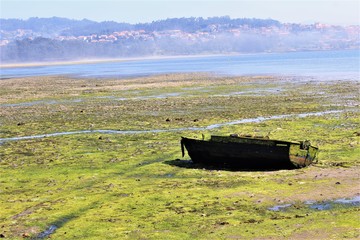 Old wooden boat parking on the beach in Combarro village, Galicia ,Spain