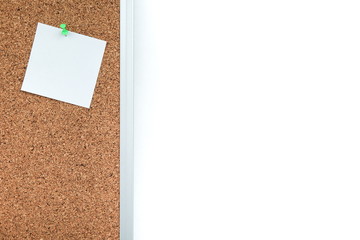 One blank note paper on cork board with copy space. Blank note paper pinned to corkboard