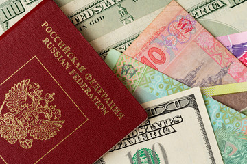 Russian passport on heap of money close up