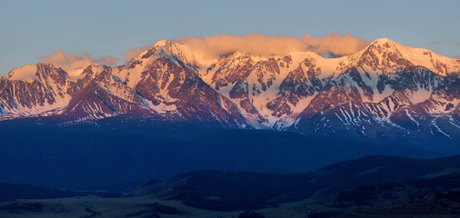 Fototapeta na wymiar Mountain peaks at sunrise, bright view, panorama nature. Traveling in the mountains, climbing.