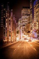 Night buildings with lights and cars at night in Montreal