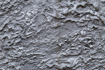 Abstract silver color painted on grunge rough surface of stucco concrete wall. Good for  texture background and wallpaper