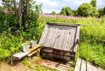 Wooden water well at the countryside