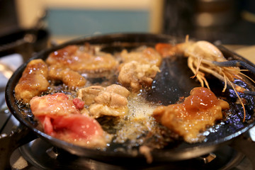 fried fresh meat in iron pan with butter boil oil
