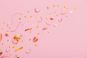 golden  confetti on pink background