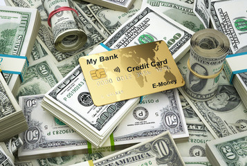 Money. US mixed scattered banknotes with a credit card.