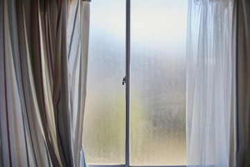 Frosty Window with Striped Curtains