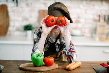 Little girl in kitchen. Cute girl cooking .