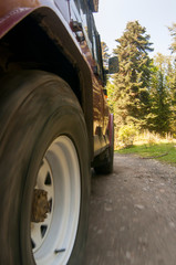 Suv offroad 4wd car rides through muddy puddle, off-road track road.