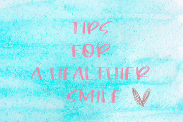 Blue toothpaste texture background with text Tips for a Healthier smile
