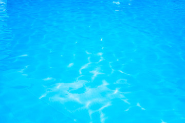 Background texture of blue water in the outdoor pool in a tropical resort