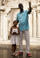 Father and daughter looking at exhibits