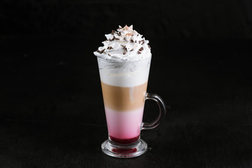 Coffee drink in glass on black background