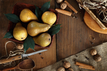 group of ripe pears lie on old planed wooden boards